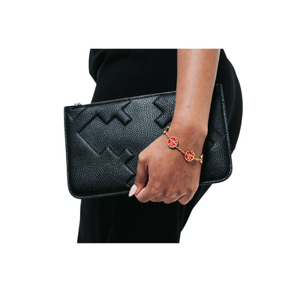 EMBOSSED WRISTLET BAG